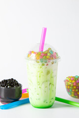 Traditional beverage of asia taiwan,  Ice buble or boba milk tea in plastic cup with straw on white background, summers refreshment.