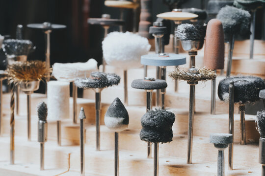 Different goldsmiths tools on the jewellery workplace.