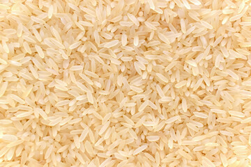 Parboiled rice texture background.  Uncooked food background. 