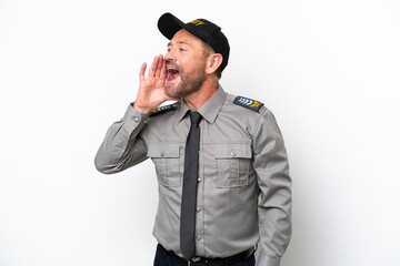 Naklejka premium Middle age security man isolated on white background shouting with mouth wide open to the lateral