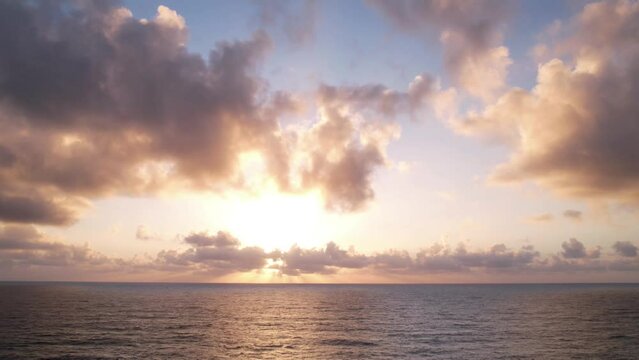 And God said, Let there be Light, beautiful stunning sunrise hyperlapse over the ocean, aerial