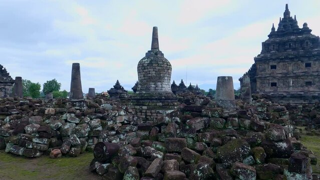 Plaosan buddha temple view in camera panning movement with stupa and artifact rocks