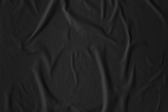 Wrinkled black poster paper texture background