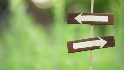 .wooden signpost on a natural green background.copy space.clipping path