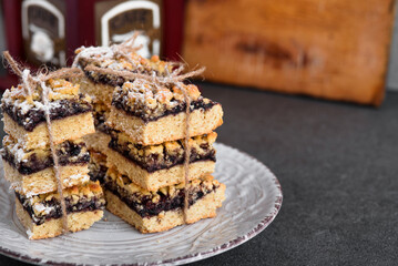 White plate with biscuit jam. Confectionery in the foreground.