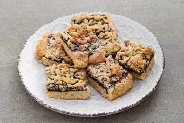 Cookies with jam on a beautiful white plate. On a gray background. White porcelain plate.