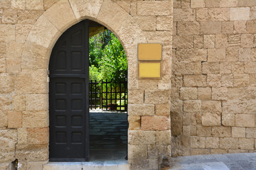 Fototapeta na wymiar ancient brick wall with arched gates, close-up