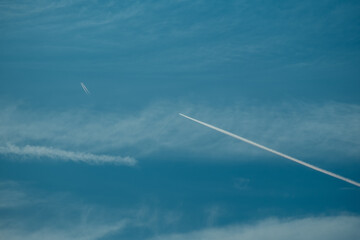 Two planes in the sky releasing chemtrails