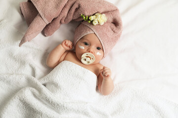 Cute little baby with cream on face, top view - obrazy, fototapety, plakaty