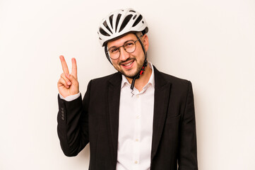 Business hispanic man wearing a helmet bike isolated on white background joyful and carefree showing a peace symbol with fingers.