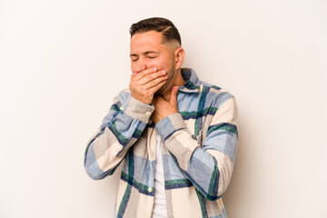 Fototapeta premium Young hispanic man isolated on white background suffers pain in throat due a virus or infection.