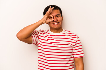 Young hispanic man isolated on white background excited keeping ok gesture on eye.