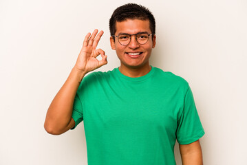 Young hispanic man isolated on white background cheerful and confident showing ok gesture.