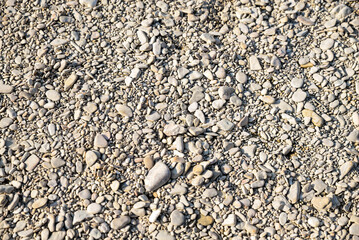 Ground covered with stones and pebbles as background