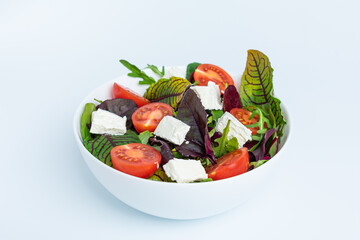Fresh salad with Cheese Feta and tomatoes isolated on white background
