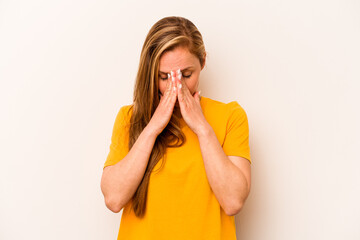 Young caucasian woman isolated on white background praying, showing devotion, religious person...