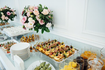 A wide variety of snacks on the table for guests. Shrimp, boiled pork, various types of meat and other products