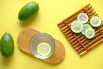Refreshing lemon water drink on table , top view 