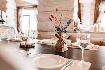 Luxury table setting for dining in a restaurant in pastel colors close up. Wedding party table set for banquet