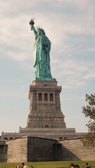 Fototapeta na wymiar Statue of Liberty, Blue Sky, Sun