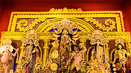 Goddess Durga idol at Durga Puja pandal in Kolkata, West Bengal, India. Durga Puja is one of the biggest religious festival of Hinduism - obrazy, fototapety, plakaty