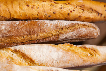 Several French baguette breads, close-up.