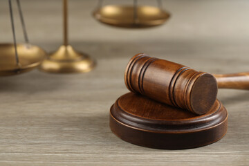 Wooden gavel on table, closeup. Space for text