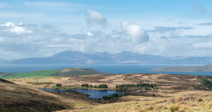 The Isle of Arran Mountains on the West Coast of Scotland in Late spring with rolling clouds and mist over goat fell giving a dramatic motion effect. From Fairlie Moor on the west coast.
