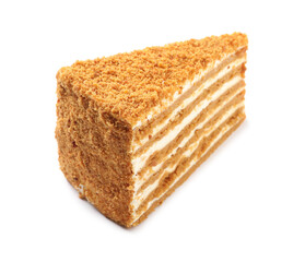 Slice of delicious honey cake isolated on white