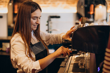 Fototapeta na wymiar Barista preparing coffee at a coffee house
