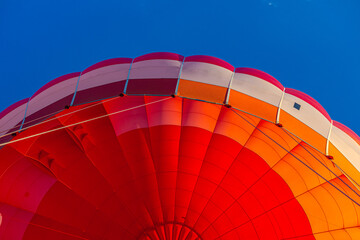 Obraz premium Colourful balloon flying in the blue sky