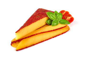 Traditional semi-hard cheese with herbs and tomatoes, isolated on white background.