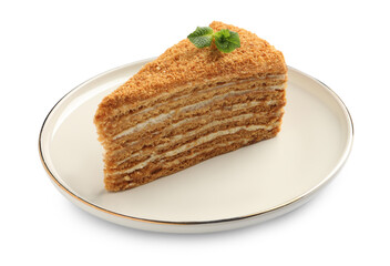 Slice of delicious honey cake with mint isolated on white