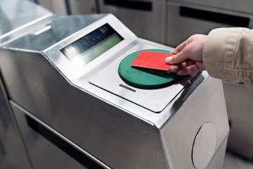Girl using metro card machine