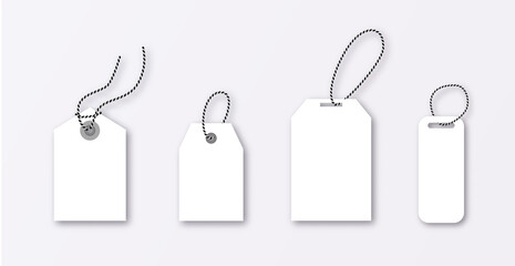 Set of luggage mockup tags isolated on a grey background with string threads, rectangular.
