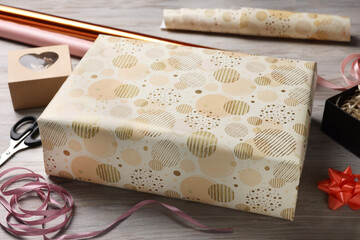 Beautifully wrapped gift boxes on wooden table