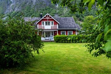 Abandoned wooden house hut under mountain