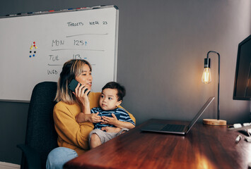 Mother of one working in her home office