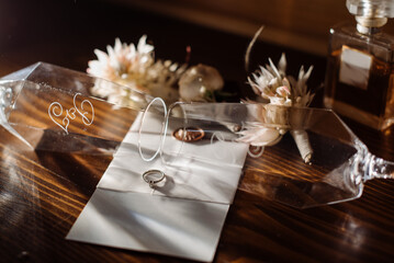 Brides wedding accesories, ring, bouquets and invitation card on flat lay wedding day