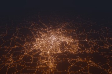 Aerial shot of Tartu (Estonia) at night, view from south. Imitation of satellite view on modern city with street lights and glow effect. 3d render