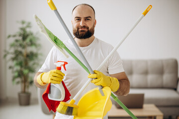 Man from cleaning company with spray detergent and cleaning equipment