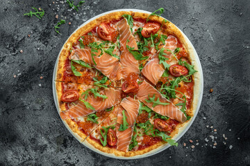 Delicious hot pizza with salmon, red caviar, tomatoes and aragula ready to eat. banner, menu, recipe place for text, top view