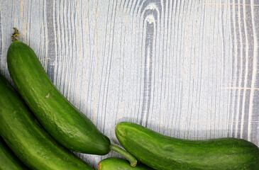 organic cucumbers on wooden background
