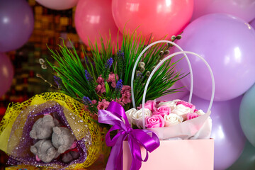 Festive background of different bouquets and colorful balloons