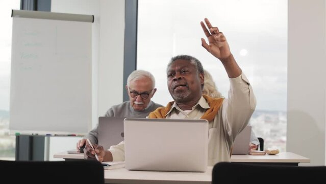 A senior student asks questions about the internet and laptop use in informatics class.