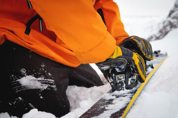 A close-up of the ski bindings as they are set up for backcountry skitouring. Sports facility skiing