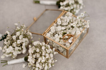 Brides wedding accesories, ring, bouquets and invitation card on flat lay wedding day