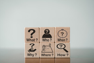 5W1H Analytical thinking with 5W1H,Root cause analysis concept.,Selective focus What,When,Who,Why,Where,How and icon on wooden cube over white background.