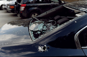 Shot cars during the war in Ukraine. Shot cars during the war in Ukraine. Cars of civilians shot by a Russian hand. car accident. war in Ukraine. car accident. shrapnel holes in cars