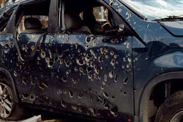Shot cars during the war in Ukraine. Shot cars during the war in Ukraine. Cars of civilians shot by...